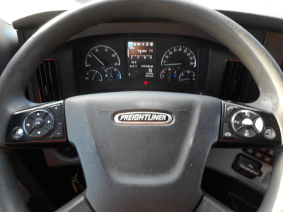 Volvo? No Freightliner steering wheel with dashboard gauges; center screen; left and right control panels visible.