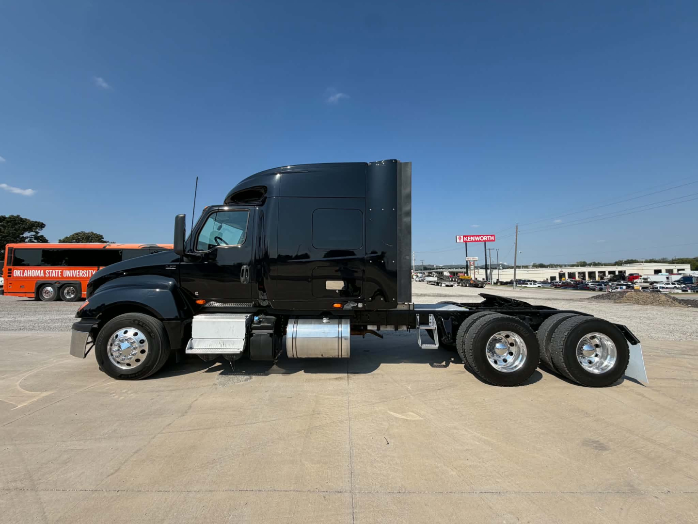 Truck chassis of a 2023 International LT625 semi-truck cab with dual rear axles and fuel tanks visible.