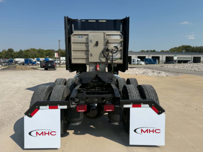 Rear view of a 2023 International LT625 truck tractor showing dual rear wheels and fuel/equipment compartments.