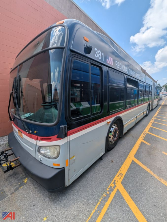 New Flyer XCelsior transit bus side view showing number 381 and REGIONAL TRANSIT AUTHORITY text along top side panel.