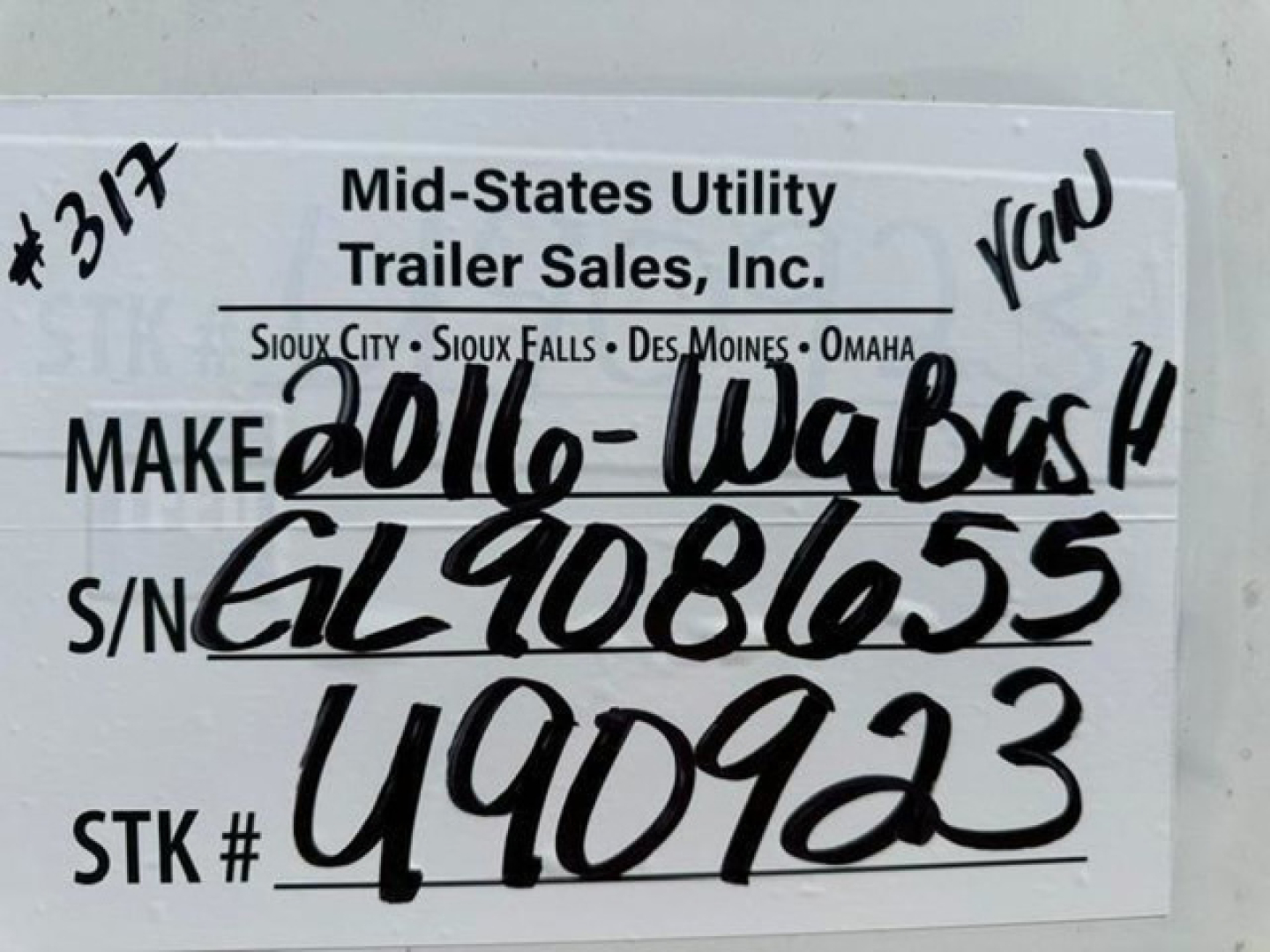 Trailer information tag showing Make 2016-Wabash, S/N GL9086055, STK # 490923, VIN 1JJV532D6GL908655, stock U90923, Mid-States Utility Trailer Sales label with handwritten model and serial.