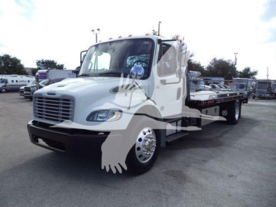 Freightliner M2 106 truck with rollback bed, white cab, front grille and headlamps visible.