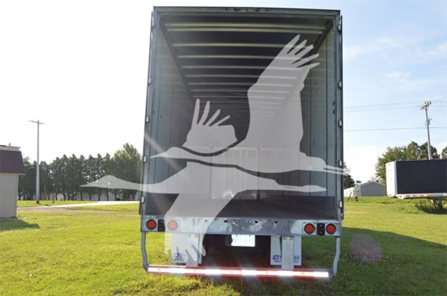 Rear view of a 2023 Wabash Duraplate trailer showing open cargo area, stock number 3013-2, VIN 1JJV532D3PL413863.