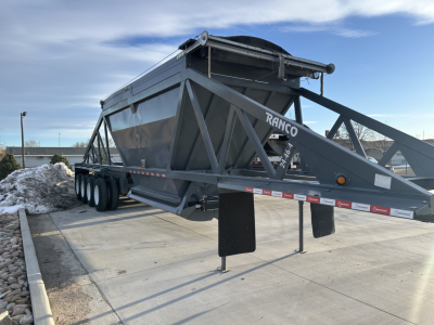 Ranco LW24464 dump trailer in-view showing underside and frame with dual-axle configuration and support legs.