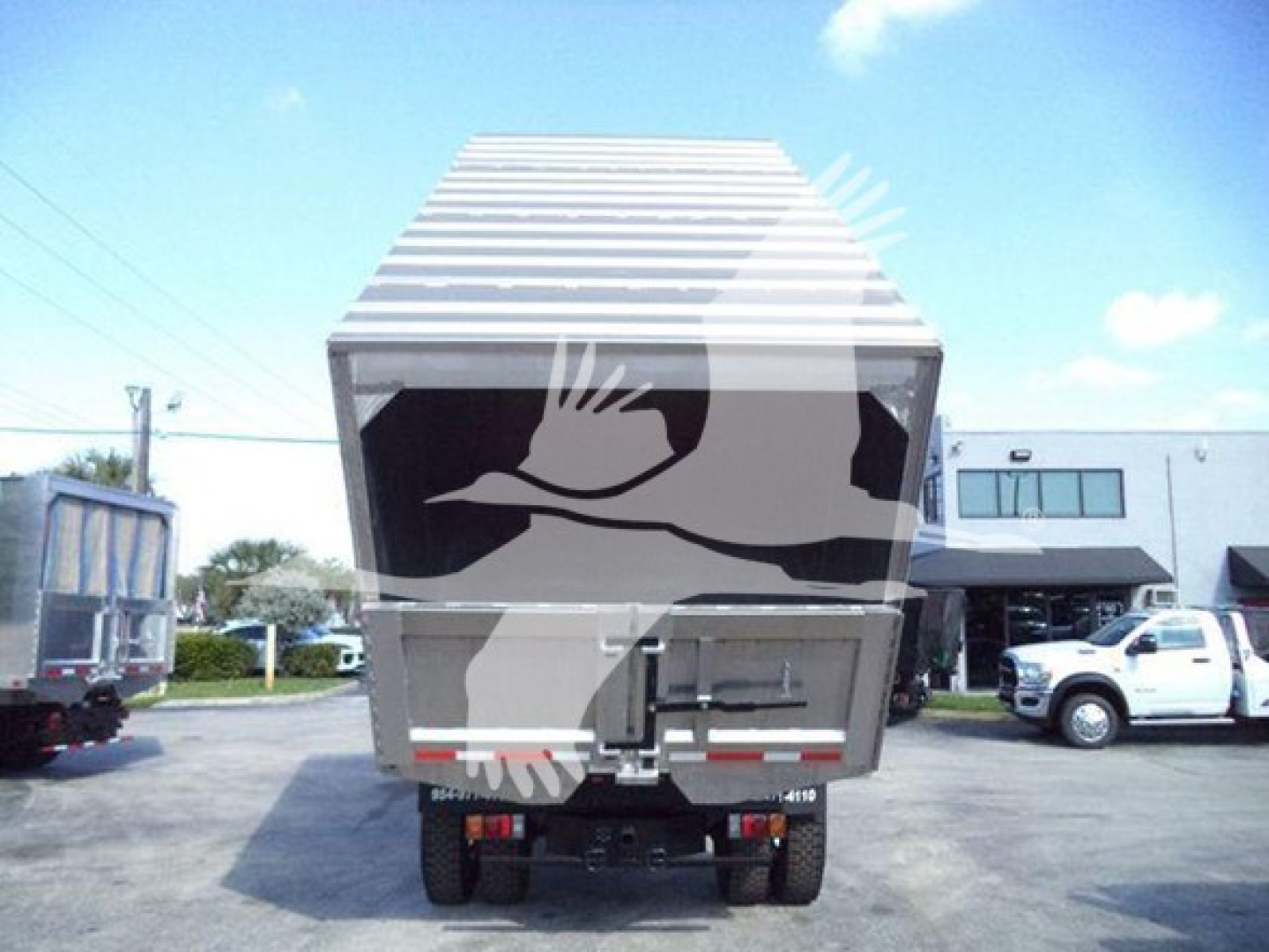 Isuzu FTR truck from rear view showing cargo dump hopper.