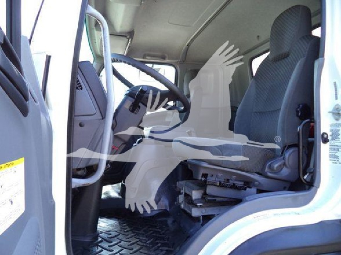 Isuzu FTR cab interior showing driver seat and dashboard area