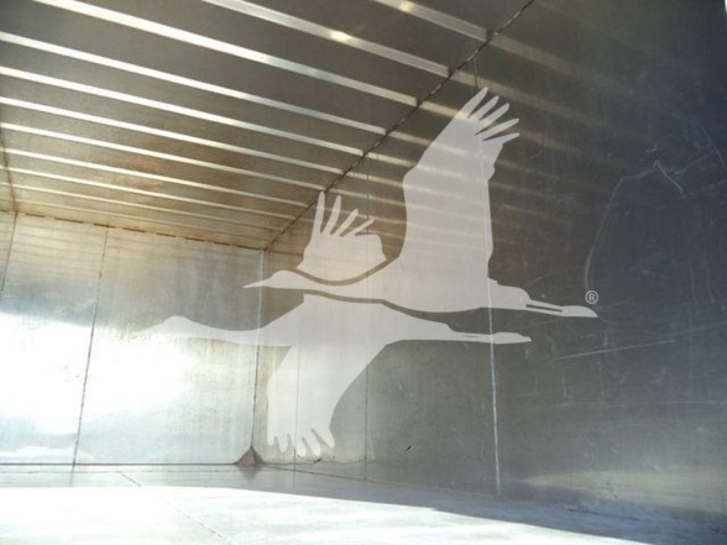 Isuzu FTR truck cargo area interior with bird graphic logo visible.