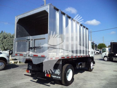 Isuzu FTR dump truck bed in side/back view showing cargo bed and rear wheels.