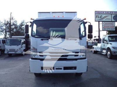 Isuzu truck front view in a lot showing Isuzu emblem on grille and truck body. Text not fully legible due to watermark.