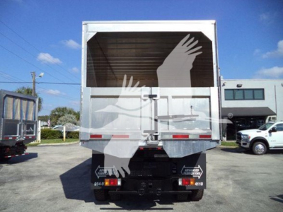 Isuzu FTR truck rear view showing large enclosed cargo area and bumper with tail lights.