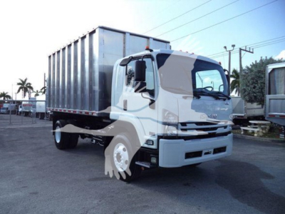 Isuzu FTR truck in yard showing cab and hopper body