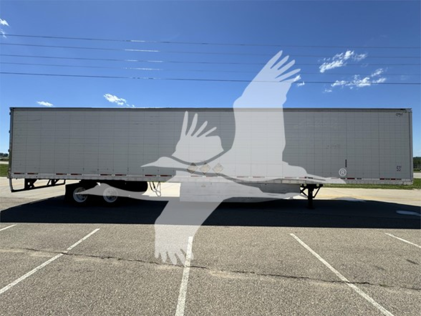 2011 Wabash reefer trailer side view with stock number 2312120, VIN 1JJV532B6BL479749. large white watermark of a bird over the trailer.