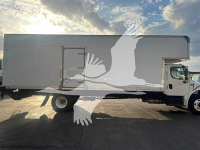 Truck side view showing a 2019 Freightliner M2 106 moving van with a large rectangular cargo box and a cab; visible wheel and side door details.