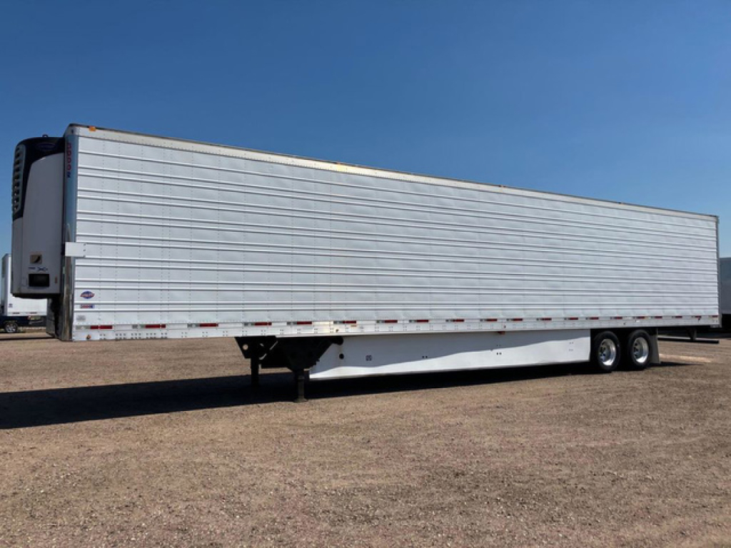 Truck trailer side view showing a 2018 utility refrigerated trailer with white aluminum siding and a reefer unit at the front left corner; two axles on right; long box