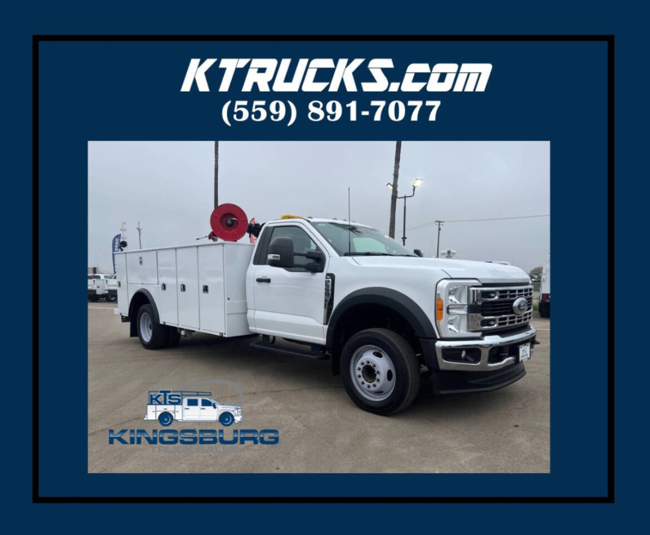 Ford F-550 service body truck in white with utility compartments and reel on rear, shown in a K Trucks Kingsburg dealership frame.