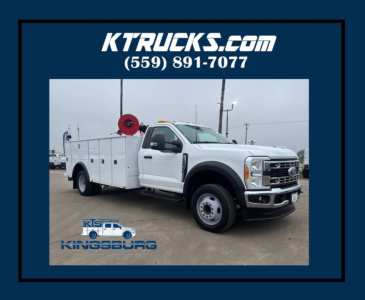 Ford F-550 service/utility truck in white with utility body, shown in a dealership lot.