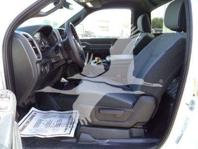 Ram 4500 SLT pickup interior with front seats, steering wheel, and center console visible from open driver door.