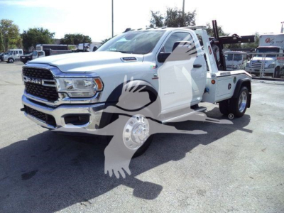 Ram 4500 Tow Truck in white with winch equipment on flatbed, front grille, chrome bumper, large tires, VIN 3C7WRLAL8PG545740 visible on listing.