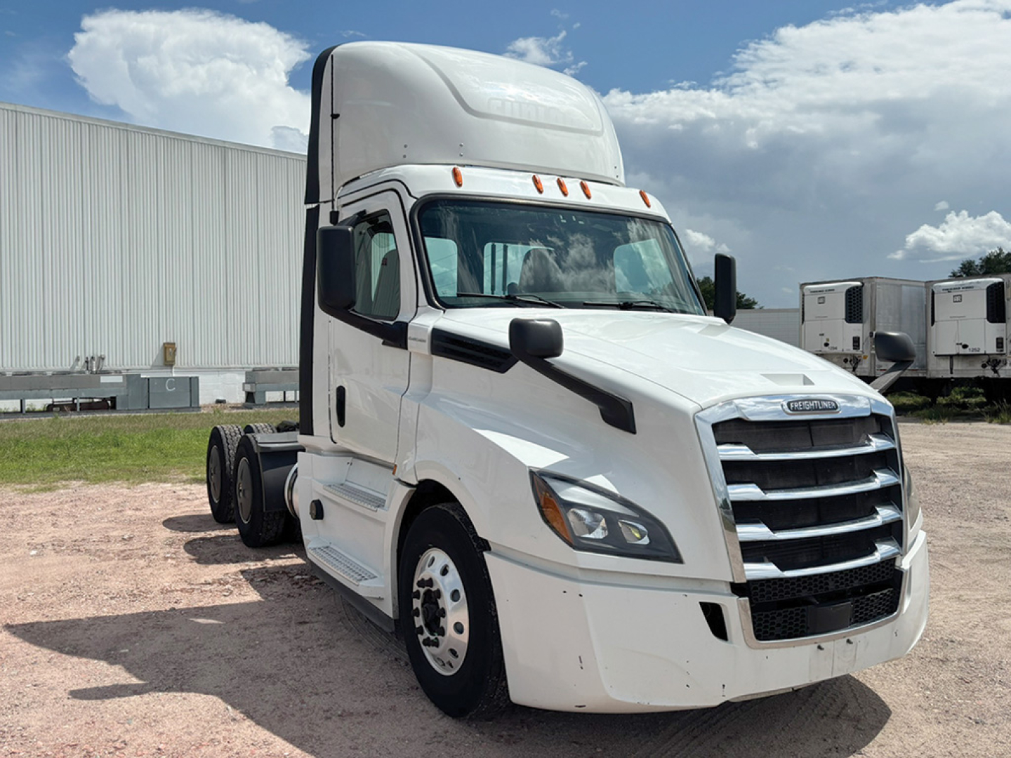 Freightliner Cascadia126 tractor unit in white from front-left view with sleeper cab; visible grille and headlights; no visible text on the truck itself.