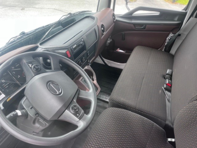 Cab and chassis interior of 2026 Hino XL7 showing steering wheel, dashboard controls, and front bench seat.