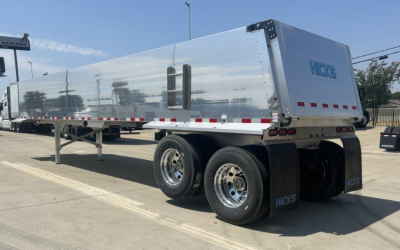 Hicks SL3729 dump trailer side and rear showing polished aluminum body, dual rear axles, and mud flaps with Hicks logo.