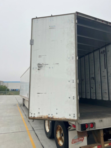 Trailer rear cargo area of a used 2014 utility van trailer showing open ramp door and interior walls, ID 1UYVS2530EP941513 and stock U91092.
