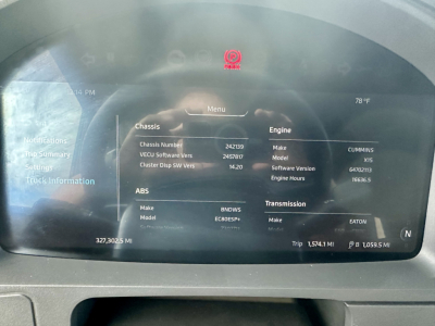 Kenworth T680 cab dashboard display showing vehicle information including chassis, ABS, engine, transmission details.