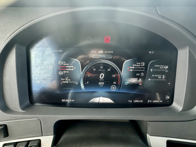 Kenworth T680 instrument cluster display showing digital gauges and trip data.