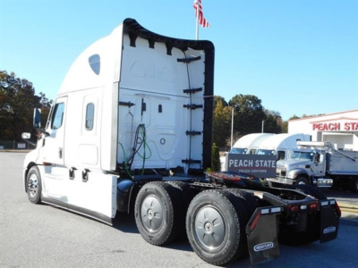 Freightliner Cascadia 126 truck cab and rear view showing sleeper, wheels, and chassis with white paint.