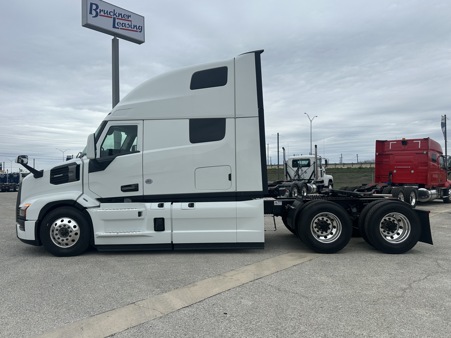 Mack PR64T76H tractor unit side view showing sleeper cab and rear wheel configuration.