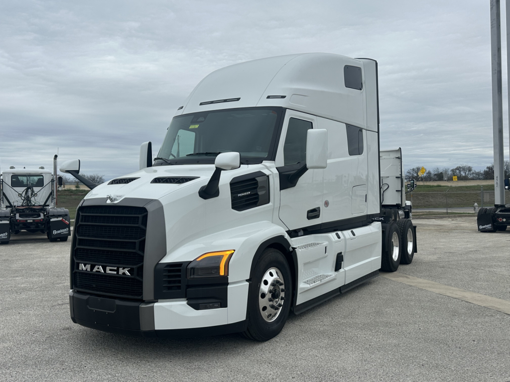 Mack PR64T76H tractor in white, front three-quarter view, showing sleeper cab and chrome wheel rims.