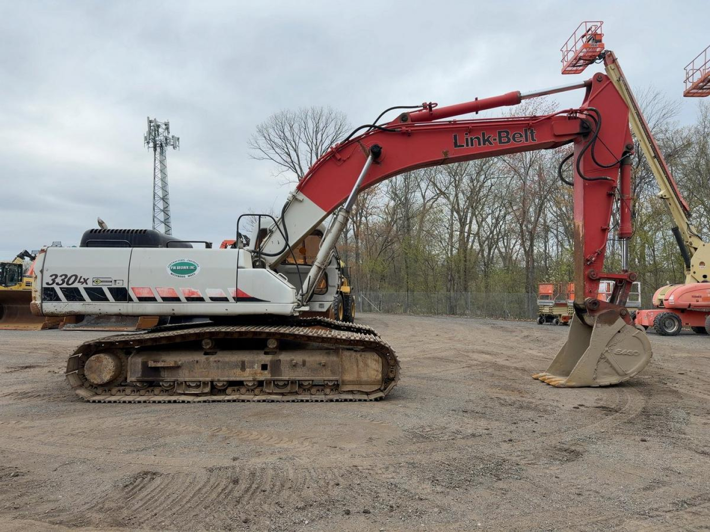Link-Belt 330LX excavator in-profile view showing red boom and gray undercarriage with tracks.