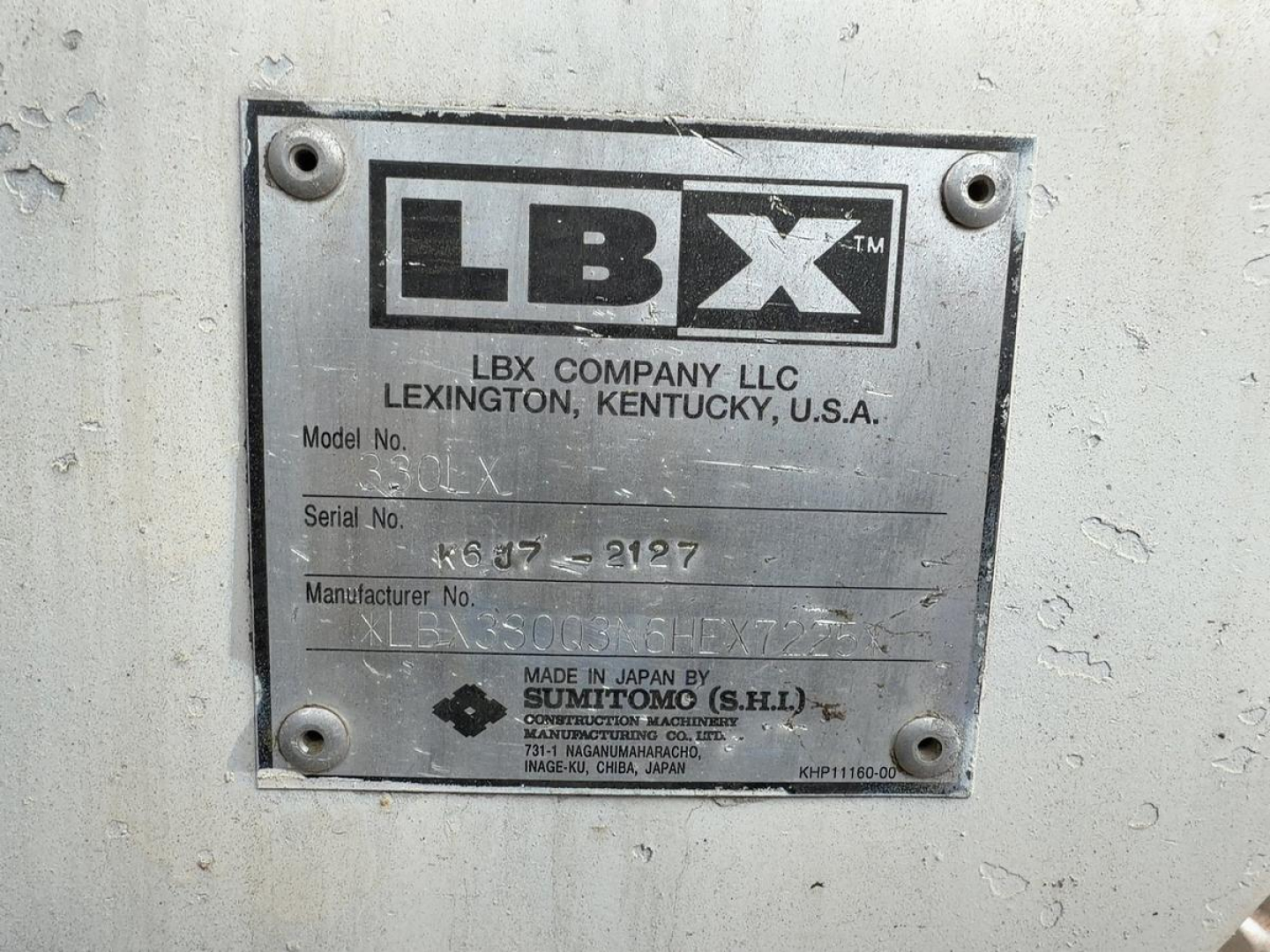 Label plate on Link-Belt equipment showing LBX company plate with model and serial numbers.