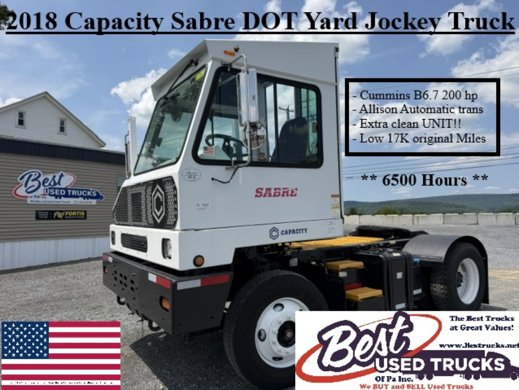2018 Capacity Sabre DOT Yard Jockey Truck showing cab label and Cummins B6.7 200 hp text, Allison trans, low miles, 6500 hours, white truck with Sabre logo.
