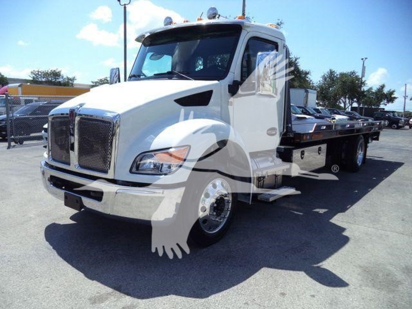 Kenworth T280 rollback tow truck in white with flatbed, shown from front-left angle.