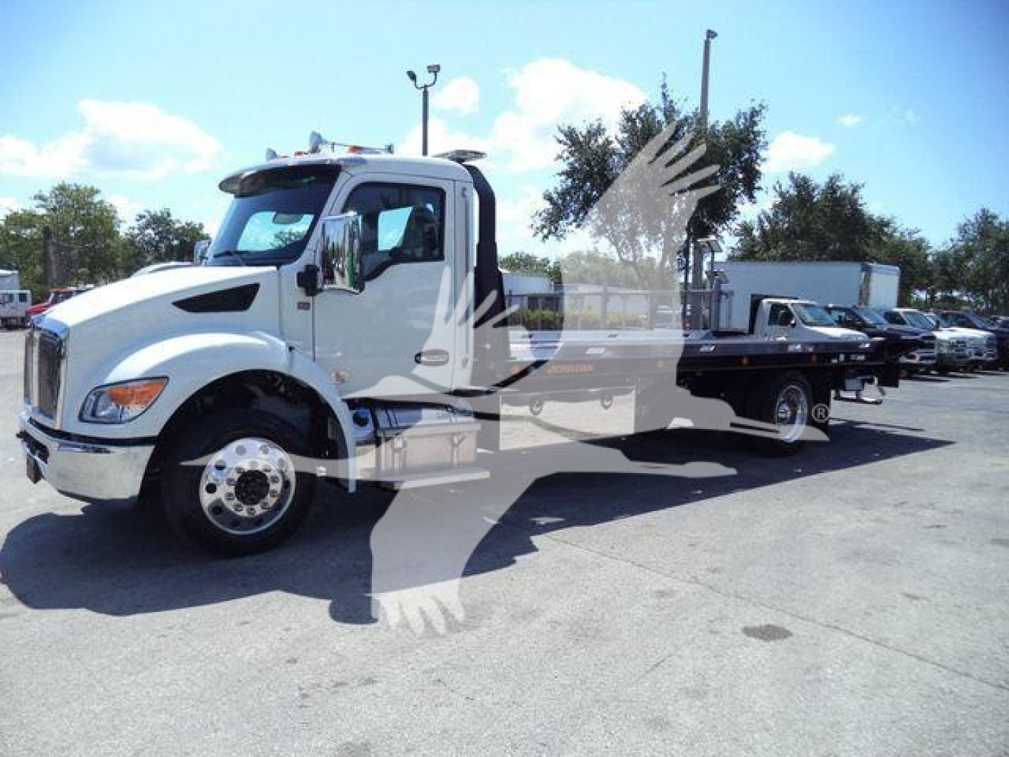 Kenworth T280 rollback truck in white, side view showing cab and flatbed with hoist and wheelbase.