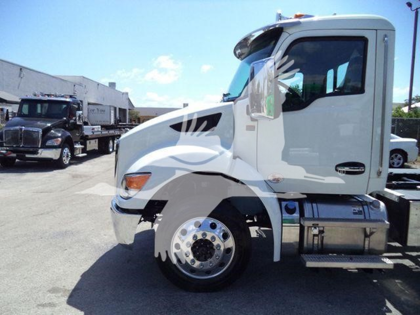 Kenworth T280 rollback truck side view showing cab, front wheel, fuel tank, and side step. No visible engine text; no readable labels or numbers.