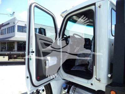 Kenworth T280 rollback truck cab interior with door open showing seat and dashboard.