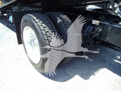 Kenworth T280 rollback truck dual rear wheels and undercarriage showing suspension and frame components.