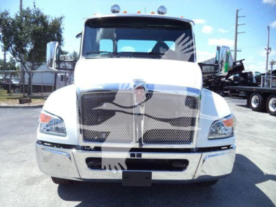 Truck front view with chrome grille and Kenworth badge; no visible text on the grill aside from emblem; reflections on bumper; basic vehicle exterior image.
