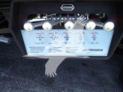 Kenworth T280 rollback control panel with multiple levers and a JERR-DAN label visible.
