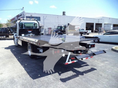 Kenworth T280 rollback truck rear view showing flatbed and towing equipment; no readable labels or serial plates visible.