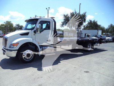 Kenworth T280 rollback truck in white, side view showing cab and flatbed with hoist and wheelbase.