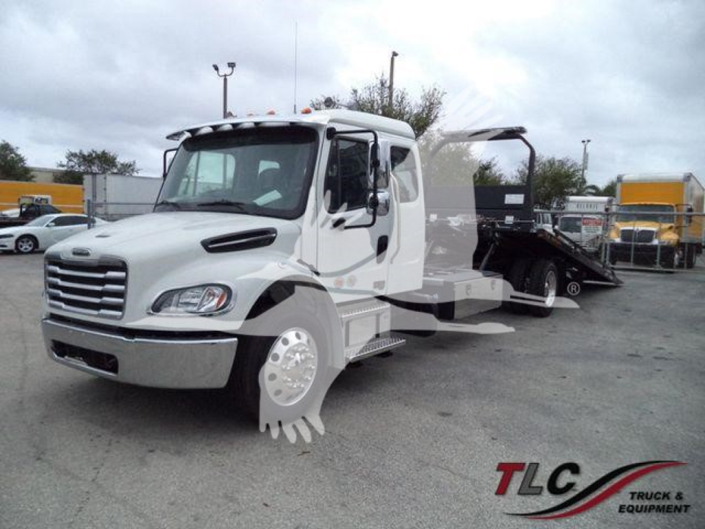 Freightliner M2 106 rollback truck in white viewed from front-left, with additional equipment in bed and decal TLG Truck & Equipment watermark