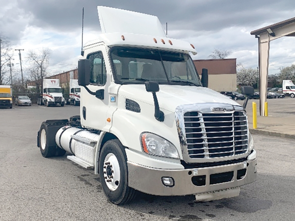 Freightliner Cascadia 113 daycab truck showing front view with grille, cab mirrors, and raised roof sleeper area.