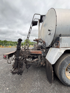 GMC ACL distributor truck rear and tank with dual rear wheels and hydraulic plumbing visible.