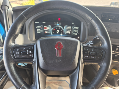 Kenworth T680 dashboard and steering wheel interior showing digital gauge cluster and steering wheel controls