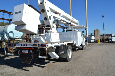 2008 Ford F-750 bucket truck with boom lift, rear view showing Titan/Mab equipment, multiple taillights, and work truck chassis.