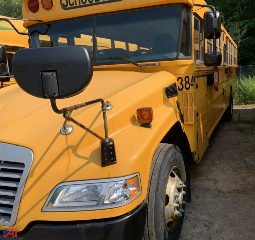 School bus front left side showing headlight, large folded mirror, orange body with bus number 38-1, blue Bird logo area, and front bumper.