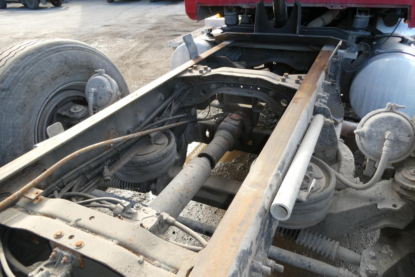 Frame and chassis of a Mack CV truck showing undercarriage components including driveline, suspension air bags, and frame rails.